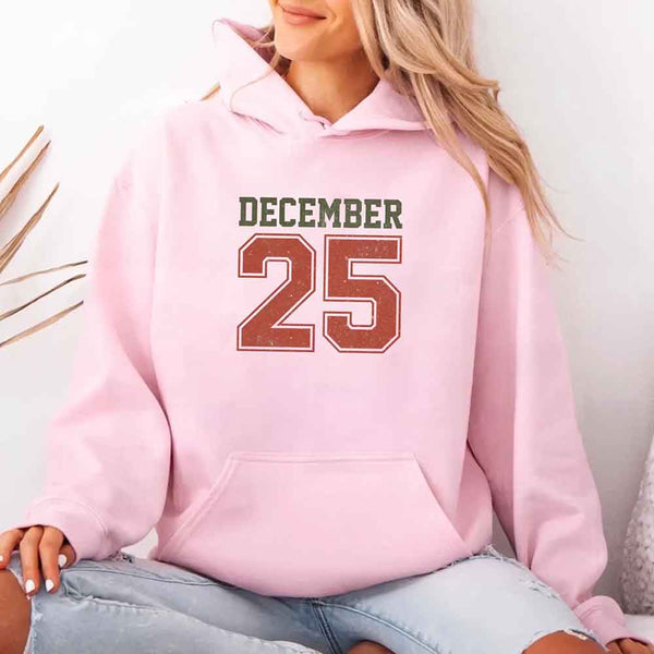May include a retro-style Christmas hoodie with the text December 25 printed in a clean, vintage-inspired design.