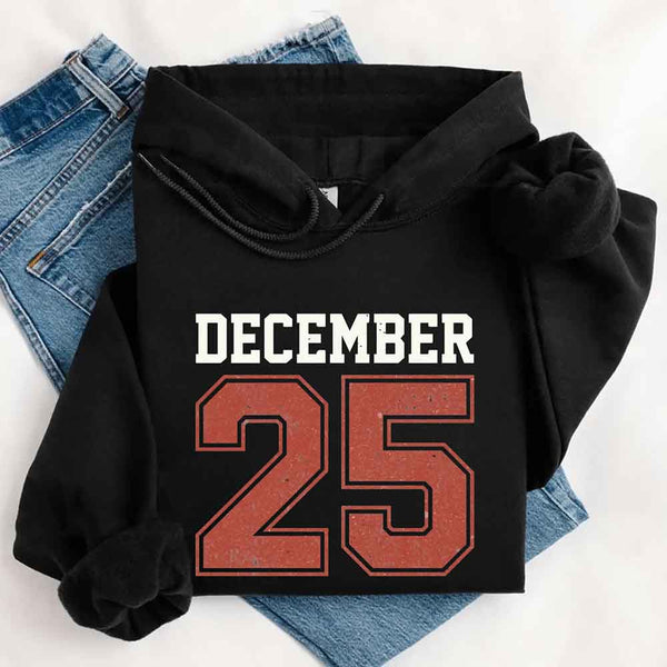 May include a retro-style Christmas hoodie with the text December 25 printed in a clean, vintage-inspired design.