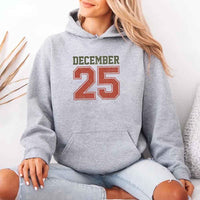 May include a retro-style Christmas hoodie with the text December 25 printed in a clean, vintage-inspired design.