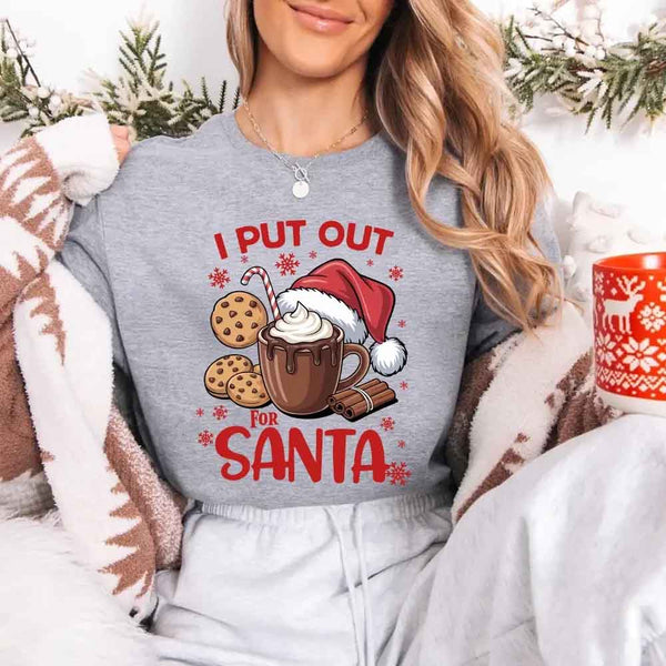May include a pair of matching Christmas couple shirts with a playful Santa phrase printed on the front, shown on a flat surface.