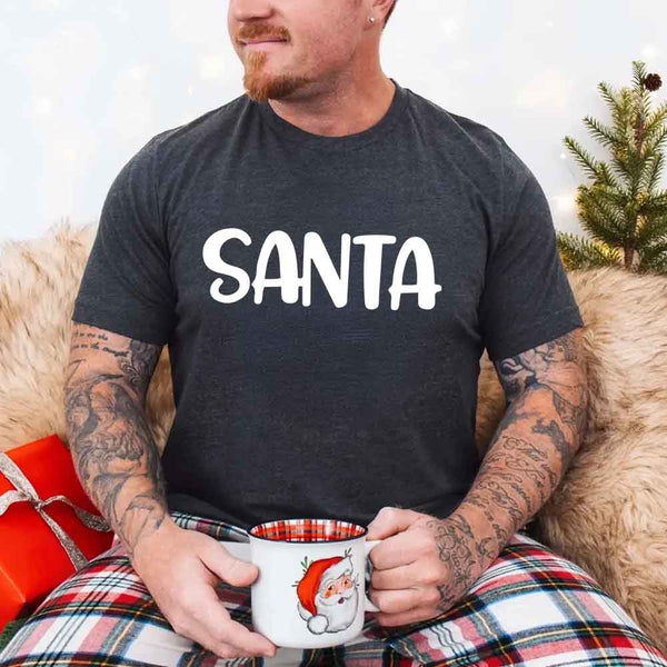 May include a pair of matching Christmas couple shirts with a playful Santa phrase printed on the front, shown on a flat surface.