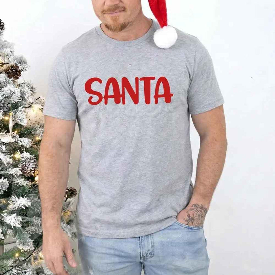 May include a pair of matching Christmas couple shirts with a playful Santa phrase printed on the front, shown on a flat surface.