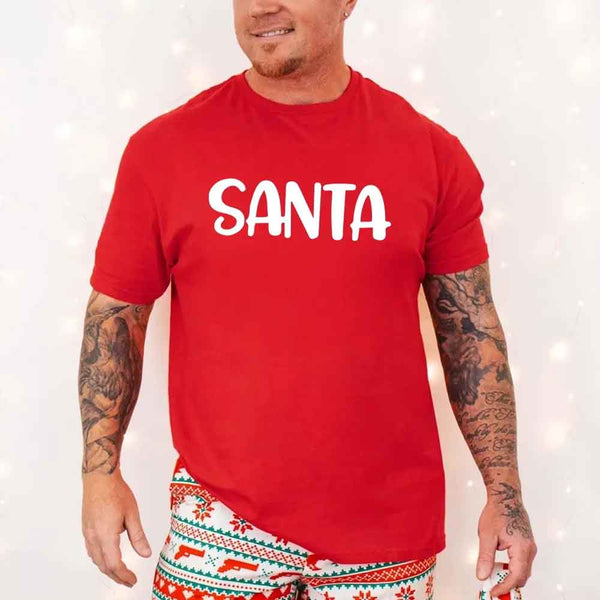 May include a pair of matching Christmas couple shirts with a playful Santa phrase printed on the front, shown on a flat surface.