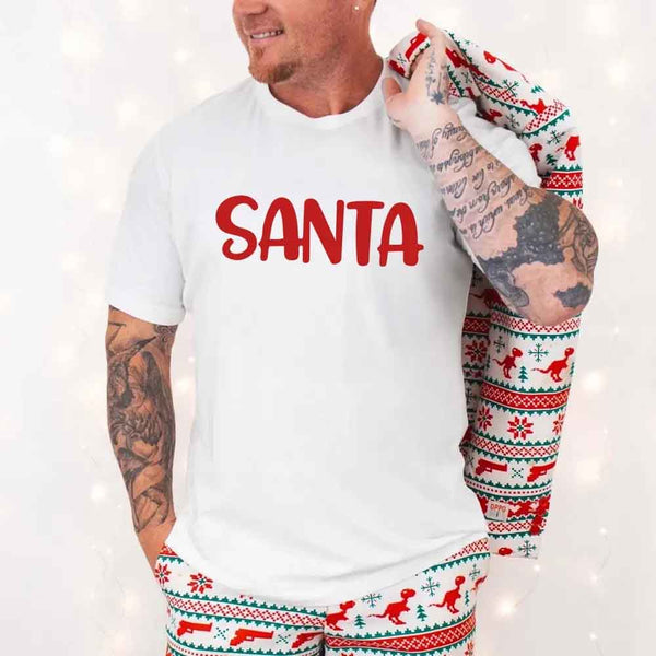 May include a pair of matching Christmas couple shirts with a playful Santa phrase printed on the front, shown on a flat surface.