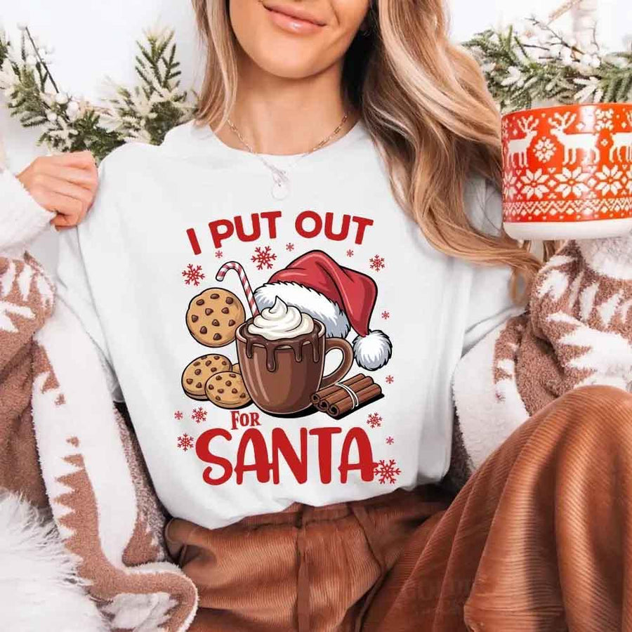 May include a pair of matching Christmas couple shirts with a playful Santa phrase printed on the front, shown on a flat surface.