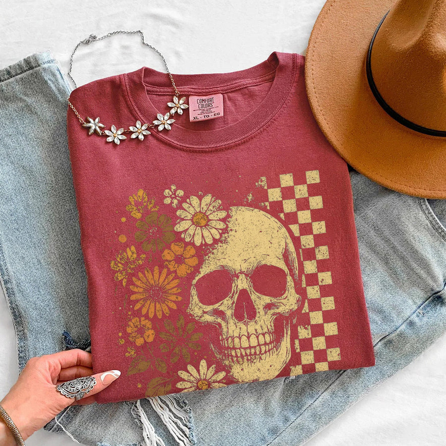 May include Skull & Flowers Firefly Comfort Colors Halloween t-shirt with skull, floral, and glowing firefly graphic on a relaxed unisex tee