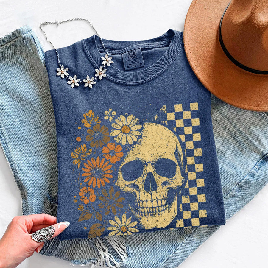 May include Skull & Flowers Firefly Comfort Colors Halloween t-shirt with skull, floral, and glowing firefly graphic on a relaxed unisex tee