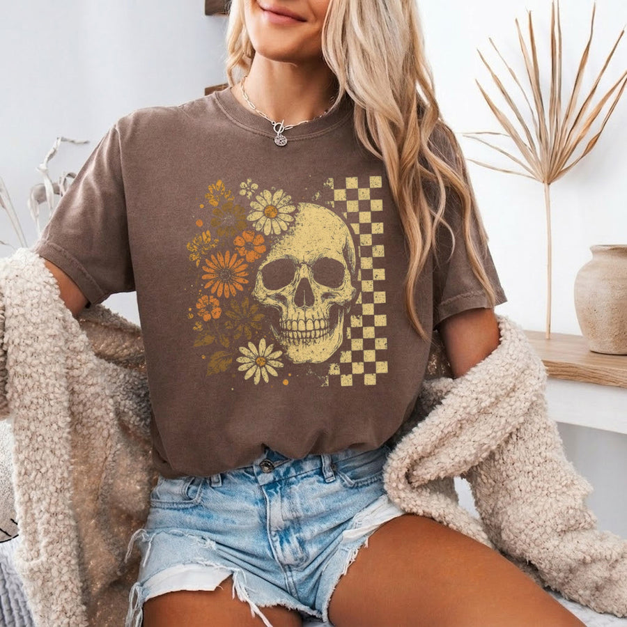 May include Skull & Flowers Firefly Comfort Colors Halloween t-shirt with skull, floral, and glowing firefly graphic on a relaxed unisex tee
