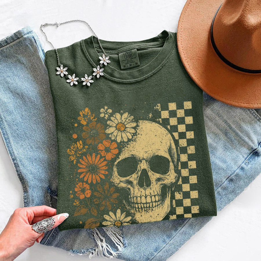 May include Skull & Flowers Firefly Comfort Colors Halloween t-shirt with skull, floral, and glowing firefly graphic on a relaxed unisex tee