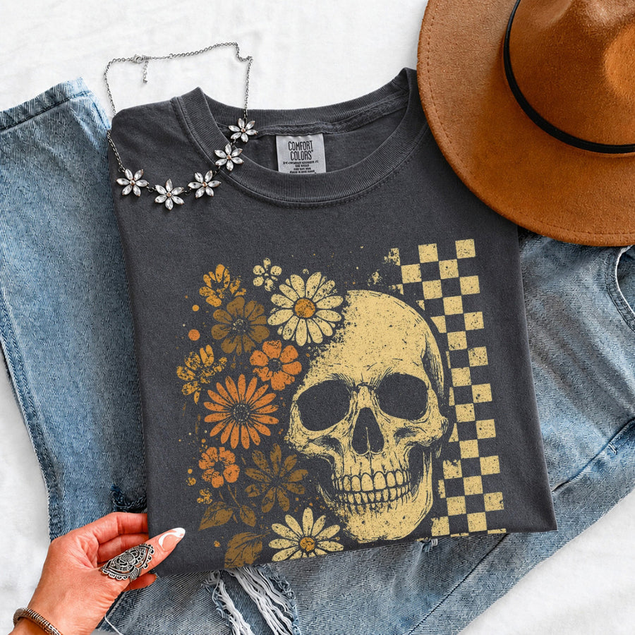 May include Skull & Flowers Firefly Comfort Colors Halloween t-shirt with skull, floral, and glowing firefly graphic on a relaxed unisex tee