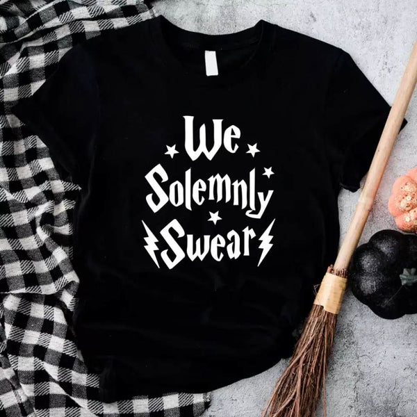 May include a matching couples or best friends t-shirt design featuring the phrase “I Solemnly Swear We Are Up to No Good” in bold, playful lettering, reflecting a fun, mischievous theme meant to be worn together.