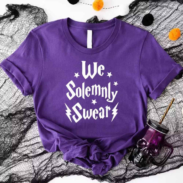 May include a matching couples or best friends t-shirt design featuring the phrase “I Solemnly Swear We Are Up to No Good” in bold, playful lettering, reflecting a fun, mischievous theme meant to be worn together.