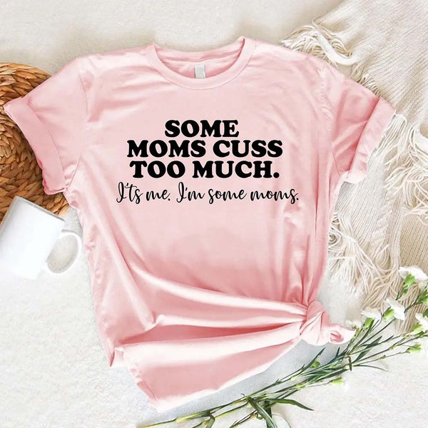 Pink t-shirt with humorous text some moms cuss too much on a light background