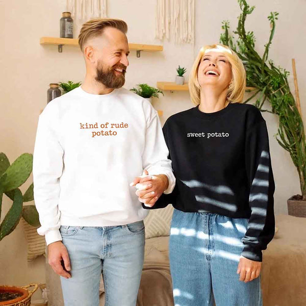 May include a pair of matching Thanksgiving-themed sweatshirts featuring the playful “Sweet Potato” and “Rude Potato” designs. The cozy crew necks are styled in warm fall colors, making them a fun and festive choice for couples during the autumn and holiday season.