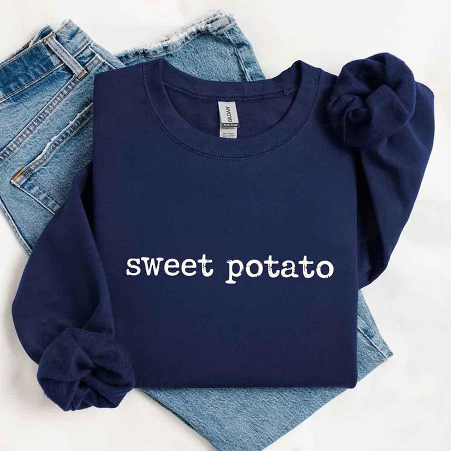 May include a pair of matching Thanksgiving-themed sweatshirts featuring the playful “Sweet Potato” and “Rude Potato” designs. The cozy crew necks are styled in warm fall colors, making them a fun and festive choice for couples during the autumn and holiday season.
