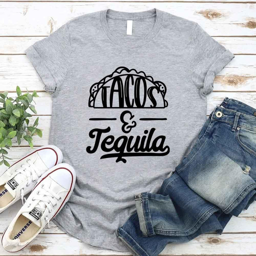 May include a unisex T-shirt with the phrase Tacos and Tequila printed on the front.