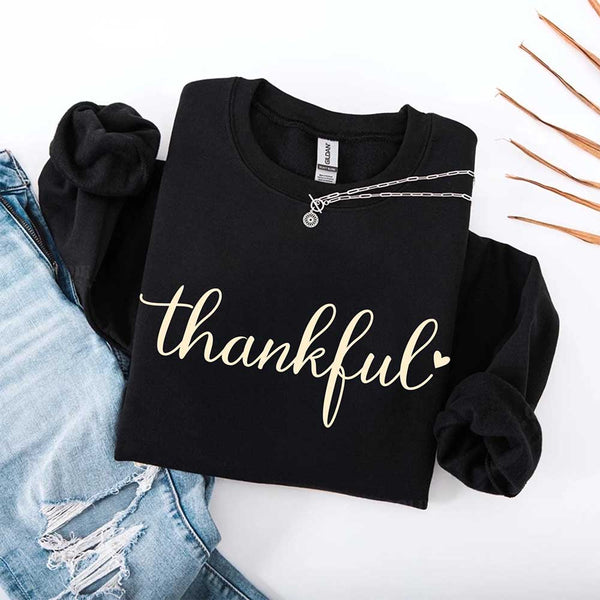 Black sweatshirt with 'thankful' text on a white background