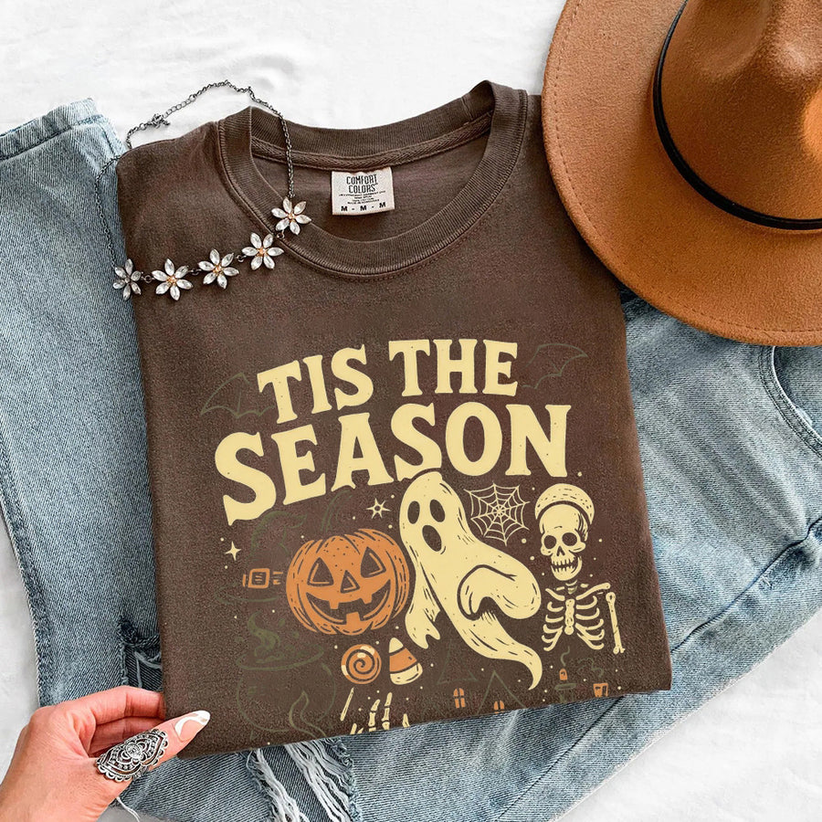 May include 'Tis The Season Comfort Colors t-shirt with Halloween graphic, relaxed unisex fit, and garment-dyed cotton