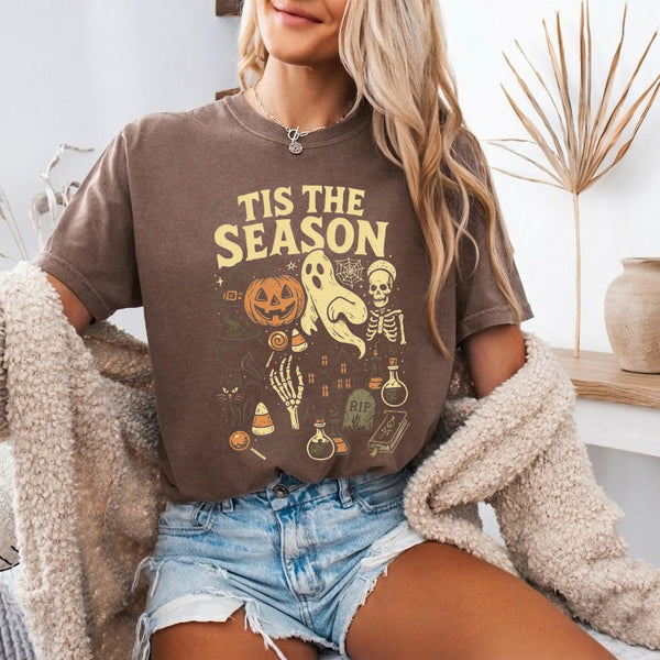 May include 'Tis The Season Comfort Colors t-shirt with Halloween graphic, relaxed unisex fit, and garment-dyed cotton