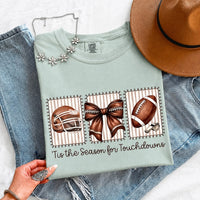 May include a Comfort Colors T-shirt featuring a 'Tis the Season for Touchdowns football-inspired design, perfect for football fans, game days, tailgates, and holiday gatherings.