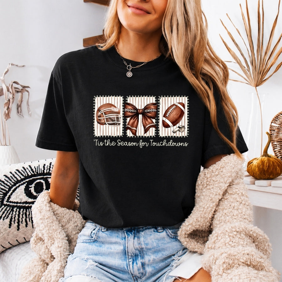 May include a Comfort Colors T-shirt featuring a 'Tis the Season for Touchdowns football-inspired design, perfect for football fans, game days, tailgates, and holiday gatherings.