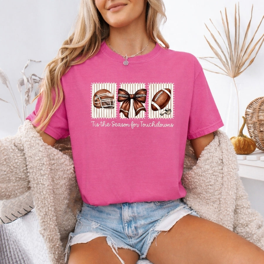 May include a Comfort Colors T-shirt featuring a 'Tis the Season for Touchdowns football-inspired design, perfect for football fans, game days, tailgates, and holiday gatherings.