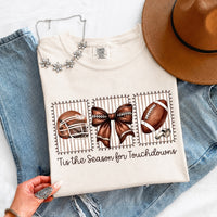 May include a Comfort Colors T-shirt featuring a 'Tis the Season for Touchdowns football-inspired design, perfect for football fans, game days, tailgates, and holiday gatherings.
