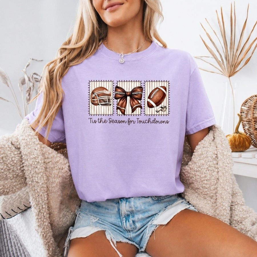 May include a Comfort Colors T-shirt featuring a 'Tis the Season for Touchdowns football-inspired design, perfect for football fans, game days, tailgates, and holiday gatherings.
