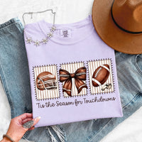 May include a Comfort Colors T-shirt featuring a 'Tis the Season for Touchdowns football-inspired design, perfect for football fans, game days, tailgates, and holiday gatherings.