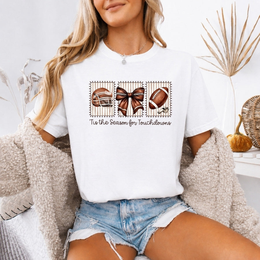 May include a Comfort Colors T-shirt featuring a 'Tis the Season for Touchdowns football-inspired design, perfect for football fans, game days, tailgates, and holiday gatherings.