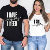 May include a couples t-shirt design featuring the phrase “I Have Everything I Need” and "I am everything" in clear, balanced lettering, often paired with a small heart or matching graphic that reflects love, gratitude, and partnership.