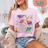 May include colorful illustrated books from the “A Court of Thorns and Roses” series surrounded by feathers, candles, and stars, with the quote “Don’t feel bad for one moment about what brings you joy,” celebrating fantasy fiction and book lover pride.
