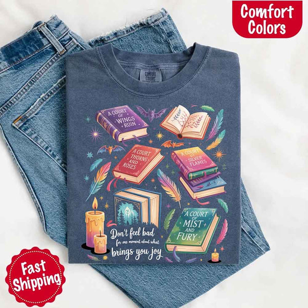 May include colorful illustrated books from the “A Court of Thorns and Roses” series surrounded by feathers, candles, and stars, with the quote “Don’t feel bad for one moment about what brings you joy,” celebrating fantasy fiction and book lover pride.