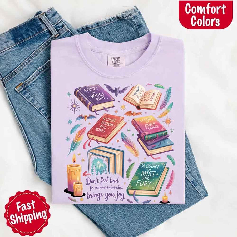 May include colorful illustrated books from the “A Court of Thorns and Roses” series surrounded by feathers, candles, and stars, with the quote “Don’t feel bad for one moment about what brings you joy,” celebrating fantasy fiction and book lover pride.