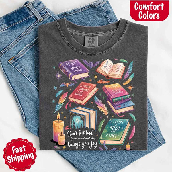 May include colorful illustrated books from the “A Court of Thorns and Roses” series surrounded by feathers, candles, and stars, with the quote “Don’t feel bad for one moment about what brings you joy,” celebrating fantasy fiction and book lover pride.