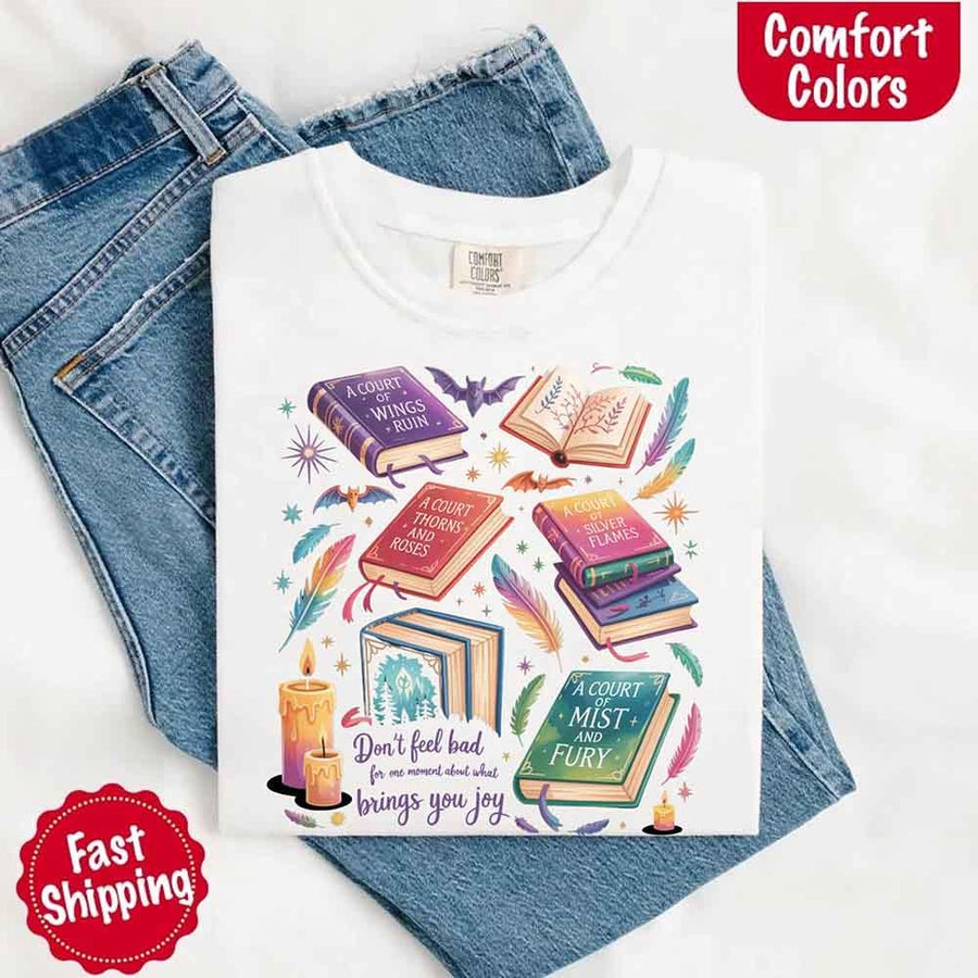 May include colorful illustrated books from the “A Court of Thorns and Roses” series surrounded by feathers, candles, and stars, with the quote “Don’t feel bad for one moment about what brings you joy,” celebrating fantasy fiction and book lover pride.