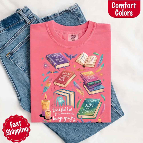 May include colorful illustrated books from the “A Court of Thorns and Roses” series surrounded by feathers, candles, and stars, with the quote “Don’t feel bad for one moment about what brings you joy,” celebrating fantasy fiction and book lover pride.
