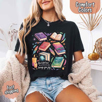 May include colorful illustrated books from the “A Court of Thorns and Roses” series surrounded by feathers, candles, and stars, with the quote “Don’t feel bad for one moment about what brings you joy,” celebrating fantasy fiction and book lover pride.