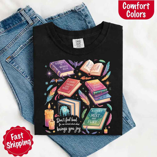 May include colorful illustrated books from the “A Court of Thorns and Roses” series surrounded by feathers, candles, and stars, with the quote “Don’t feel bad for one moment about what brings you joy,” celebrating fantasy fiction and book lover pride.