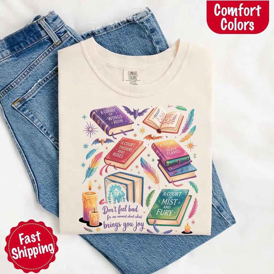 May include colorful illustrated books from the “A Court of Thorns and Roses” series surrounded by feathers, candles, and stars, with the quote “Don’t feel bad for one moment about what brings you joy,” celebrating fantasy fiction and book lover pride.