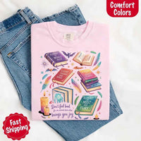 May include colorful illustrated books from the “A Court of Thorns and Roses” series surrounded by feathers, candles, and stars, with the quote “Don’t feel bad for one moment about what brings you joy,” celebrating fantasy fiction and book lover pride.
