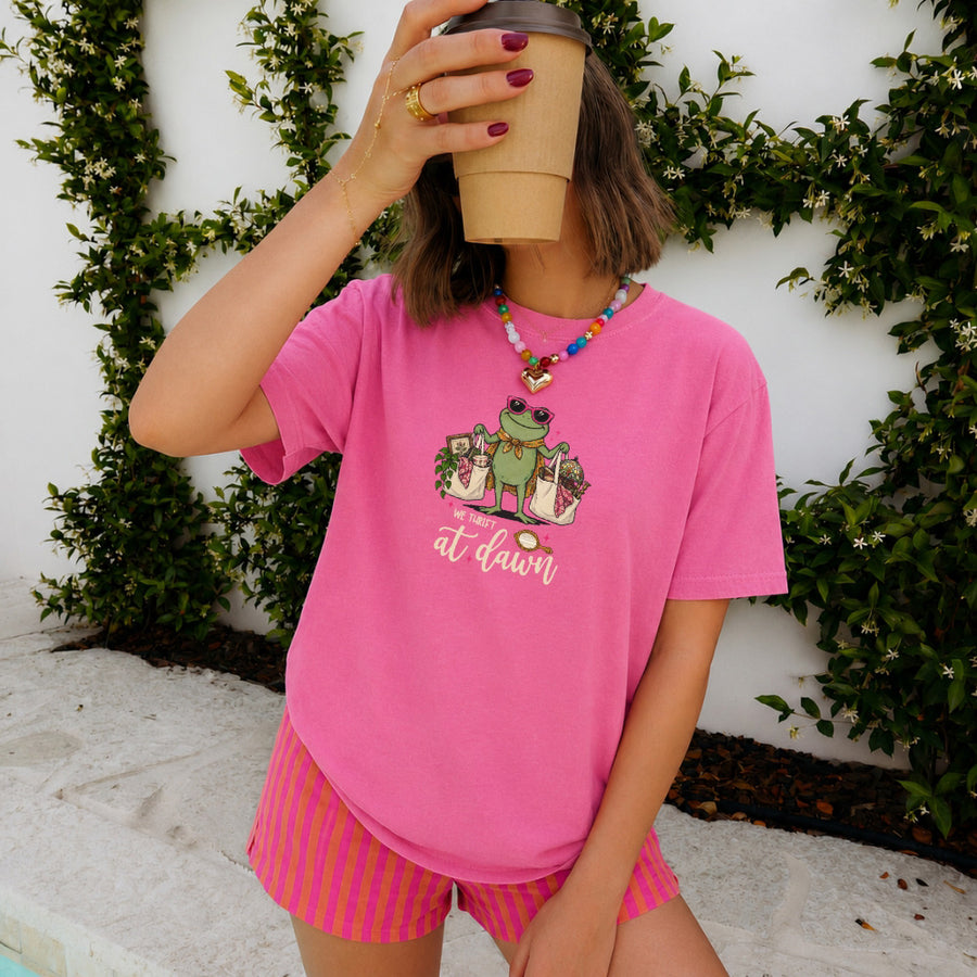 May include a We Thrift at Dawn Comfort Colors T-Shirt featuring a playful thrift-inspired statement design.