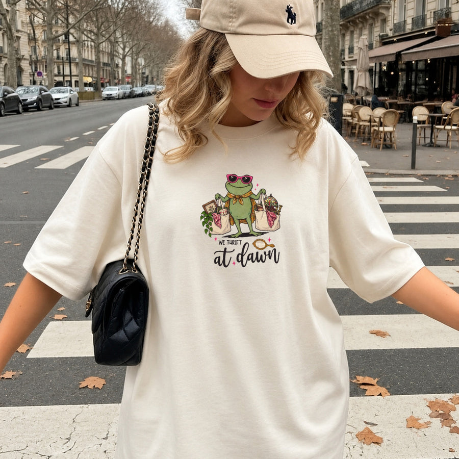 May include a We Thrift at Dawn Comfort Colors T-Shirt featuring a playful thrift-inspired statement design.