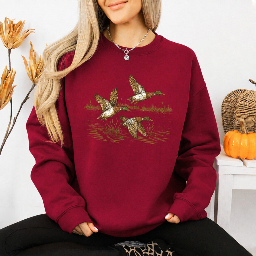 May include Wild Mallard Ducks sweatshirt with mallard duck graphic, classic unisex crewneck, long sleeves, and soft fleece fabric