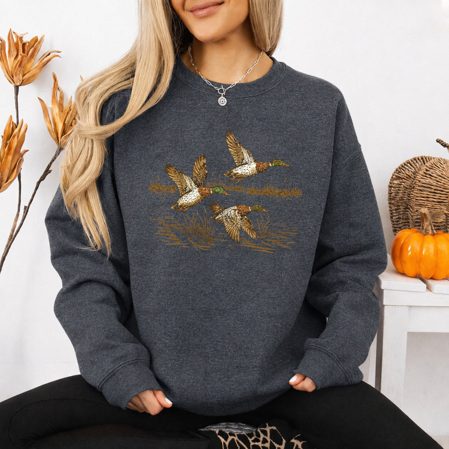 May include Wild Mallard Ducks sweatshirt with mallard duck graphic, classic unisex crewneck, long sleeves, and soft fleece fabric
