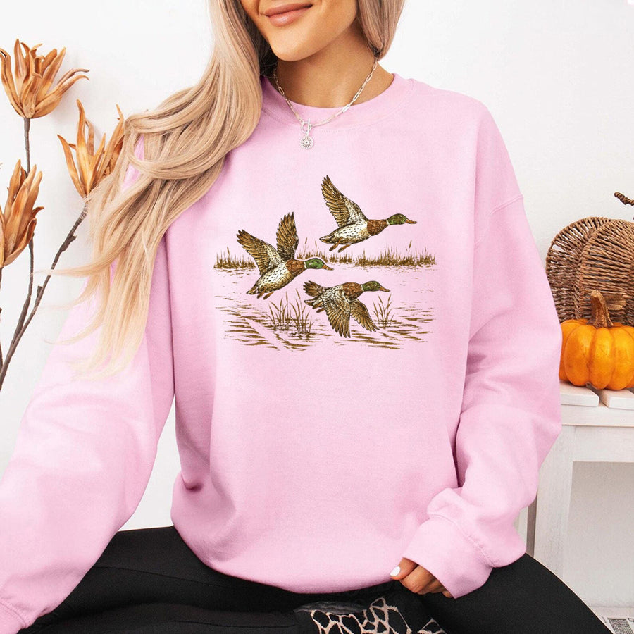 May include Wild Mallard Ducks sweatshirt with mallard duck graphic, classic unisex crewneck, long sleeves, and soft fleece fabric