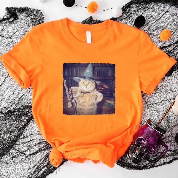 May include a Halloween t-shirt with a funny wizard cat meme graphic, combining magical and spooky design elements for cat lovers.