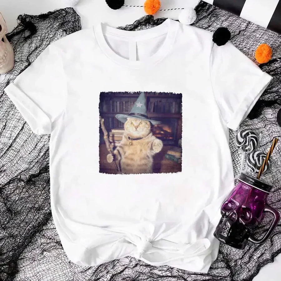 May include a Halloween t-shirt with a funny wizard cat meme graphic, combining magical and spooky design elements for cat lovers.