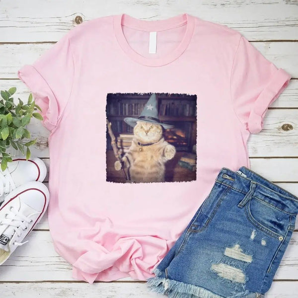 May include a Halloween t-shirt with a funny wizard cat meme graphic, combining magical and spooky design elements for cat lovers.