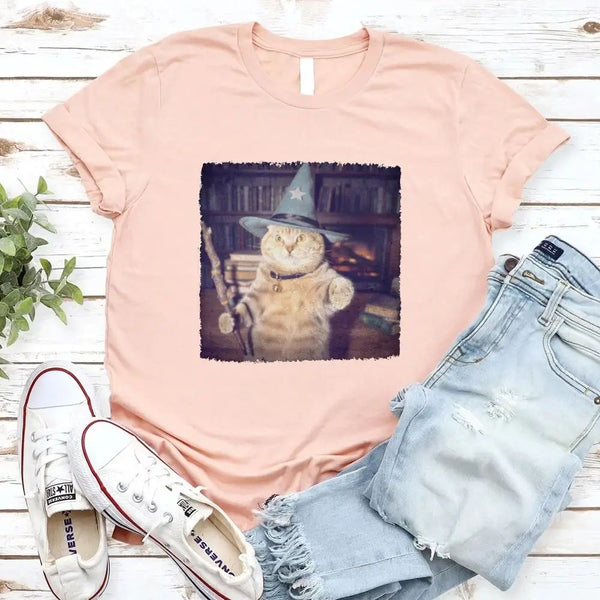 May include a Halloween t-shirt with a funny wizard cat meme graphic, combining magical and spooky design elements for cat lovers.